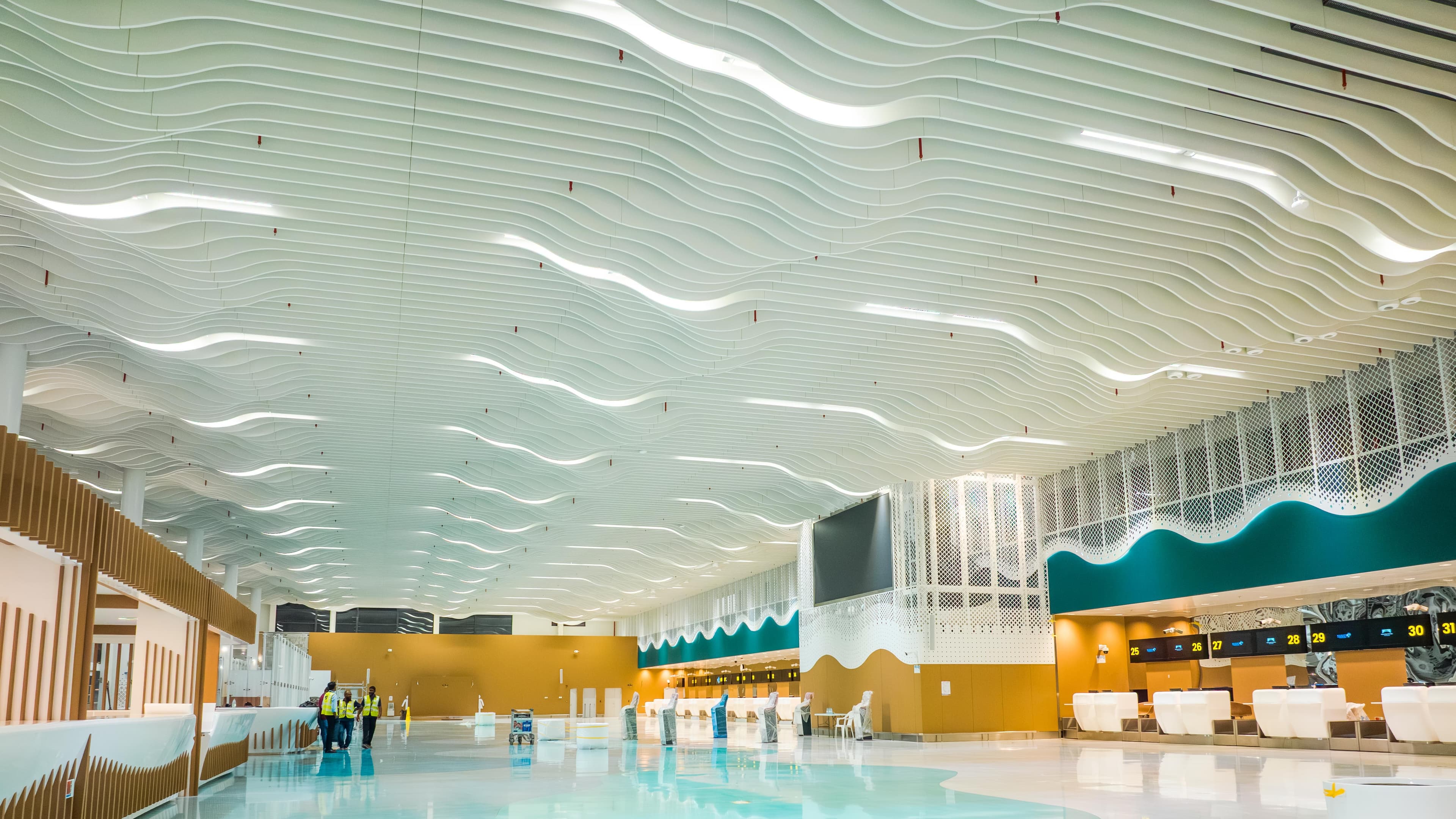 Airport terminal hall with a sculpted wave ceiling design